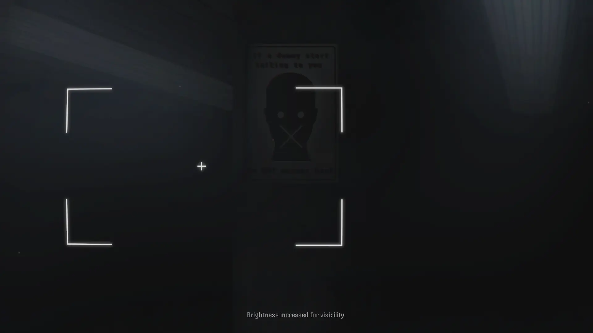 A dark facility corridor seen through the in-game camera