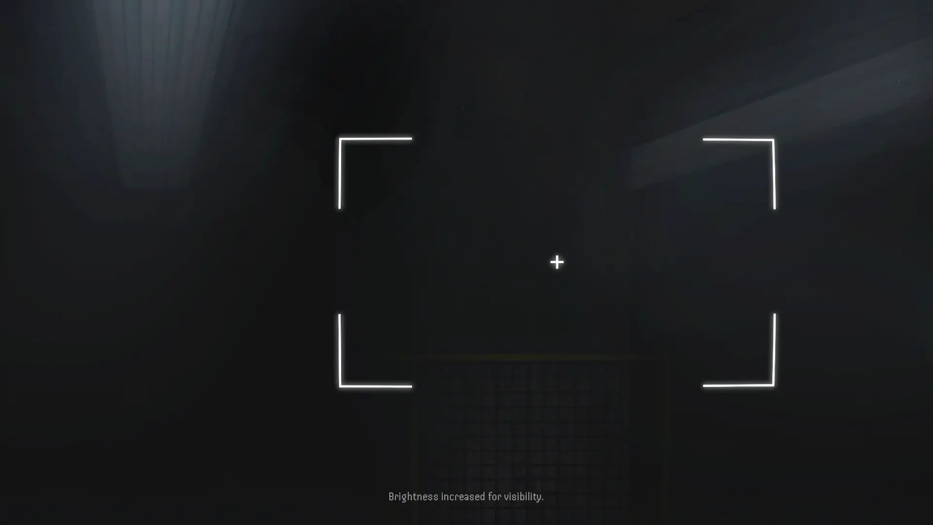 A nearly dark room seen through the in-game camera